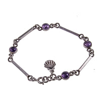 Dainty Cabochon Amethyst Silver Bracelet with Silver Shell Charm on White Background