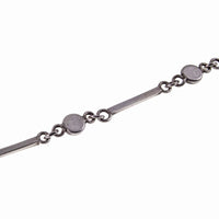 Back of Dainty Cabochon Amethyst Silver Bracelet with Silver Shell Charm
