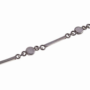 Back of Dainty Cabochon Amethyst Silver Bracelet with Silver Shell Charm