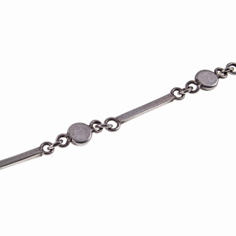 Back of Dainty Cabochon Amethyst Silver Bracelet with Silver Shell Charm