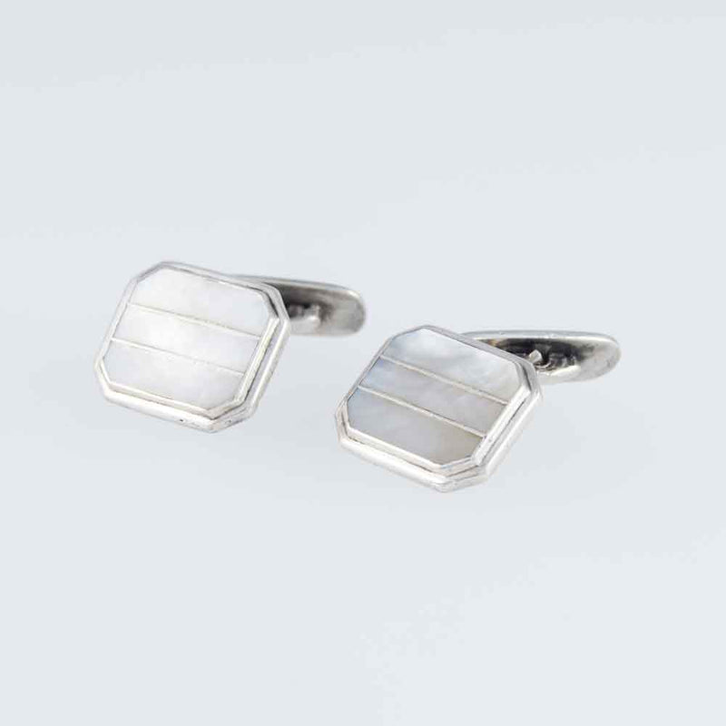A Pair of Vintage Mother of Pearl Art Deco Men's Cuff Links natural Background