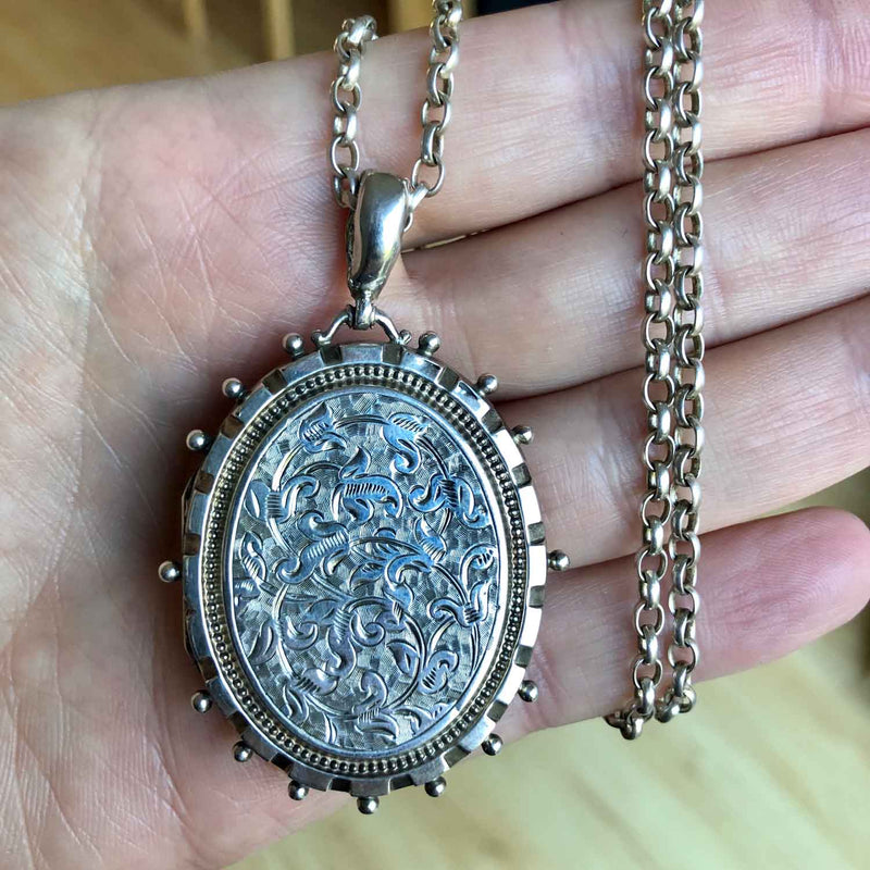 Large Victorian Engraved Silver Oval Locket in Hand