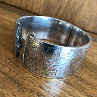 Vintage Sterling Silver Engraved Bangle with Wood Background