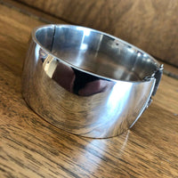 Vintage Sterling Silver Engraved Bangle - Non engraved side with Wooden Background