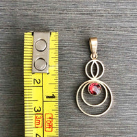 Size Scale for A Petite Art Deco 9ct Gold Garnet Circular Drop Pendant