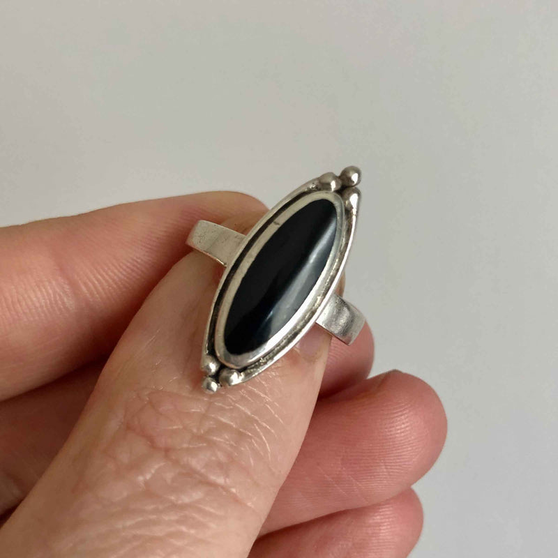 Vintage Boho Style Black Onyx Silver Ring held in Hand
