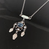 Arts and Crafts Silver and Blue Black Agate Stone Necklace on a Black background