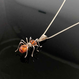 Vintage Silver and Amber Spider Pendant and Chain on A Black Background