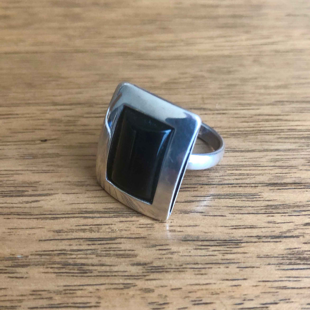 Vintage Minimalist Black Onyx 925 Silver Statement Ring sitting on Wooden Table