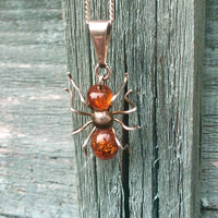 Vintage Silver and Amber Spider Pendant and Chain on Vintage Wooden Fence
