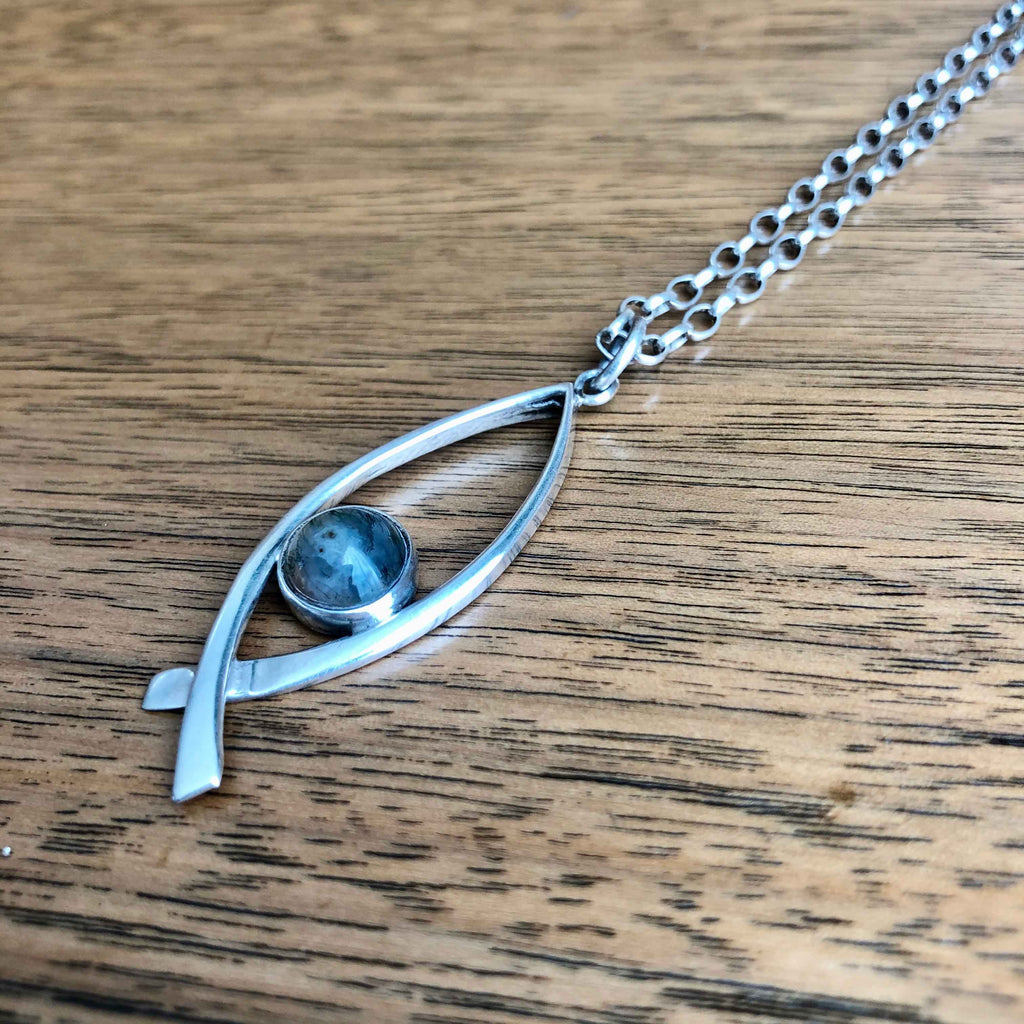 Vintage Sterling Silver Moss Agate Pendant by Malcolm Gray on Wooden Table