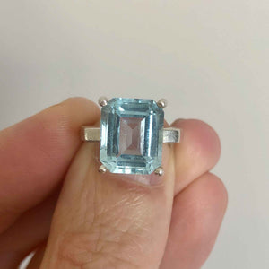 Vintage Silver Large Synthetic Emerald Cut Aquamarine Solitaire Statement Ring being Held in Hand