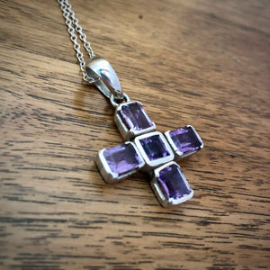 Vintage Amethyst Set Silver Greek Cross with Chain lying on Wooden Table