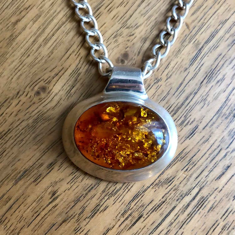 Minimalist Vintage Sterling Silver Amber Pendant on Wooden Background