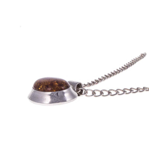 Minimalist Vintage Sterling Silver Amber Pendant lying Flat on White Background