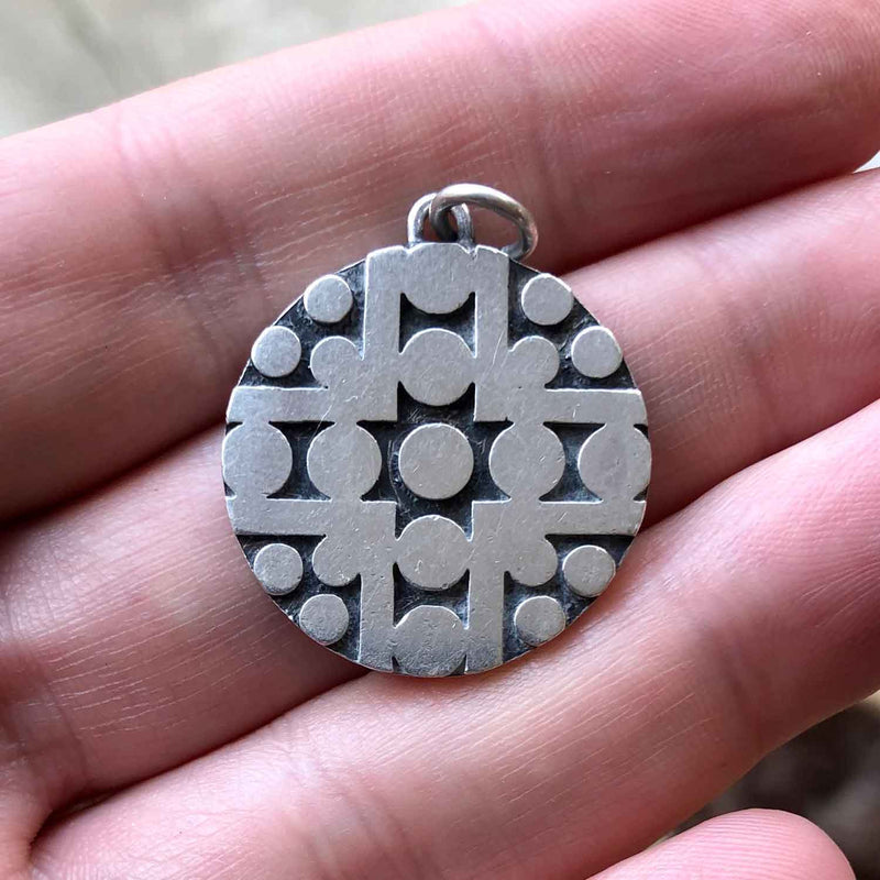 Retro Design 1960s Sterling Silver Disc Pendant in Hand