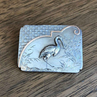 Victorian Aesthetic Period Engraved Silver Brooch c.1890s on Wooden Table