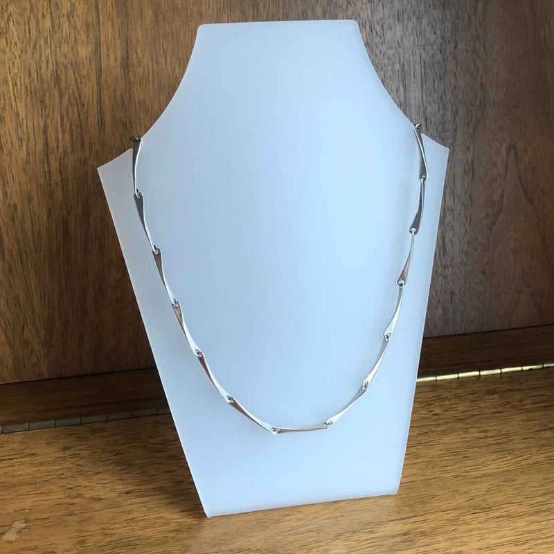 Modernist Hammered Sterling Silver Linked Necklace on Bust with Wooden Background